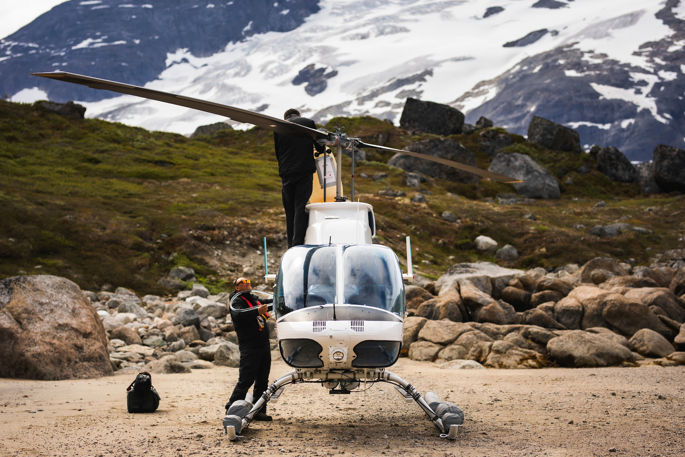 Semeq Helicopter fueling gas in the nature. Photo by Aningaaq R. Carlsen - Visit Greenland