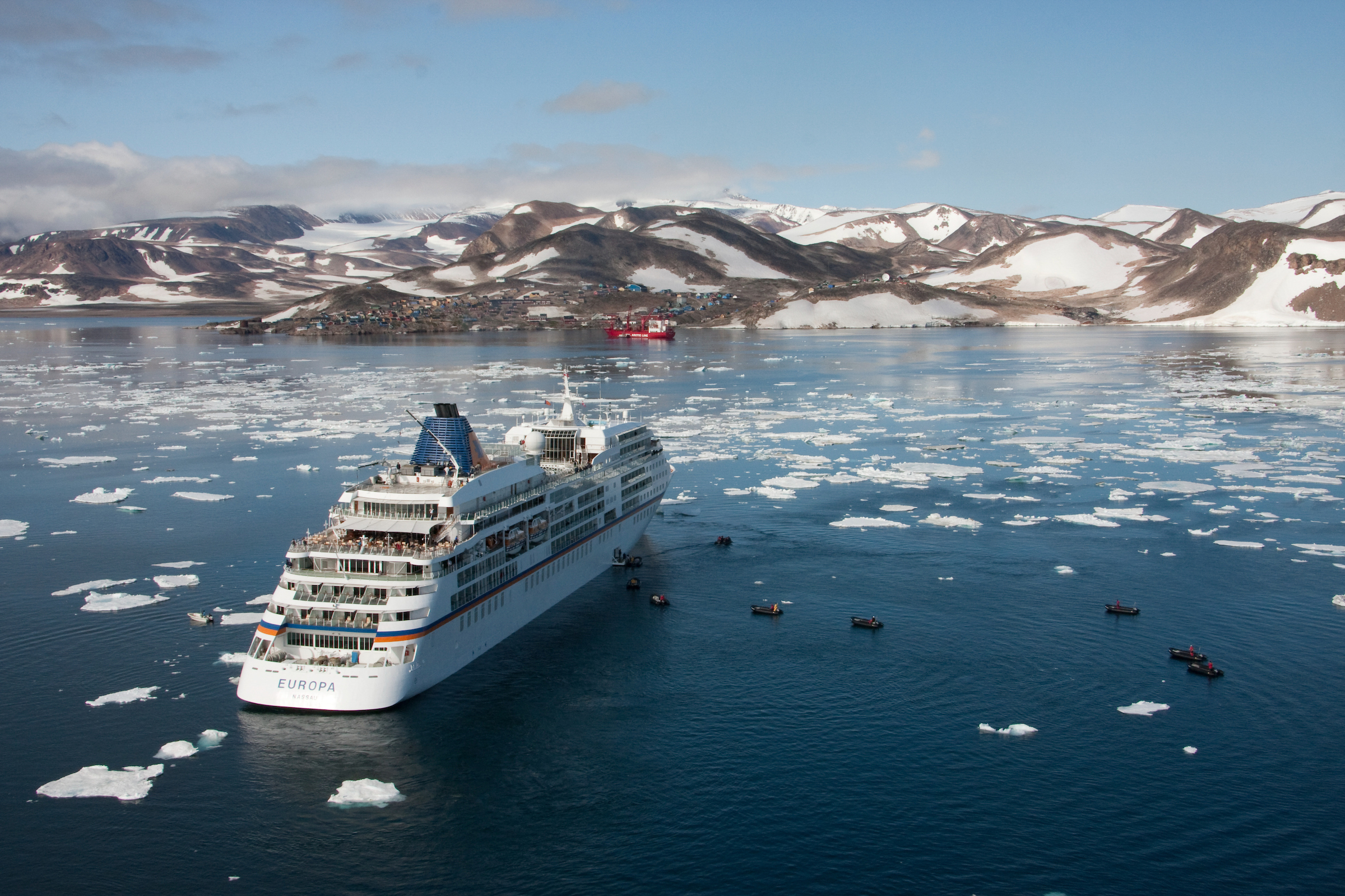 The cruise ship Europa anchored outside Ittoqqortoormiit in East Greenland. Photo: Frank Petersen - Visit Greenland